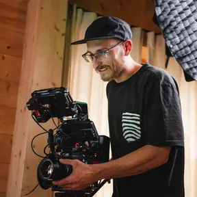 Me operating a cinema camera on set